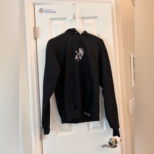 Black hoodie with astronaut figure